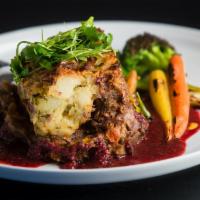 Shepherds Pie · meatless loaf mixed with carrots, onions, gravy and topped with mashed potato, served with b...