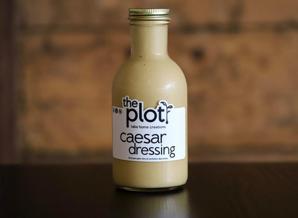 Caesar Dressing Bottle · A zesty house favorite.