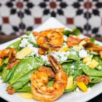 Paraiso Spinach Salad · Grilled shrimp, fresh baby spinach, goat cheese, mango, caramelized walnuts, creamy avocado ...