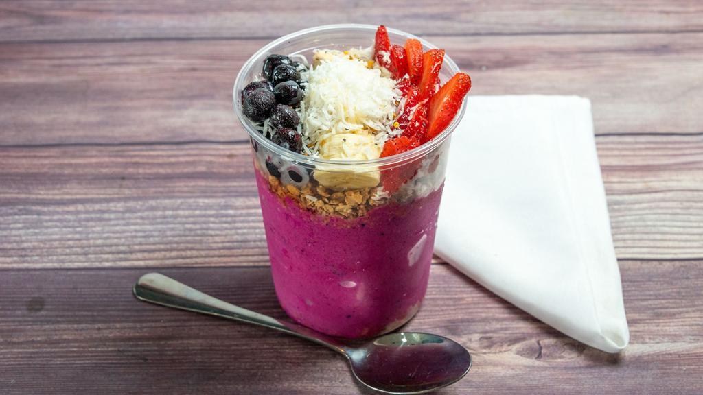 Pitaya Bowl · Large Pitaya Bowl comes blended with strawberries, banana, and apple juice. Topped with granola, banana, strawberries, shredded coconut, blueberries, chia seeds, bee pollen, and agave.