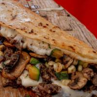 Veggie Burrito · Comes with rice, beans, bell pepper, zucchini, mushrooms, corn, onion and cilantro wrapped w...