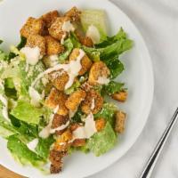 Caesar Salad · Romaine lettuce, diced tomatoes, parmesan cheese, seasoned croutons, Caesar dressing.