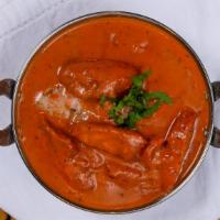 Butter Chicken · Chicken cooked with herbs and ground spices in homemade butter sauce.