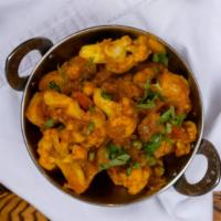Aloo Gobi · Vegetarian. Potato and cauliflower cooked in the slow fire with cumin seeds, coriander & gre...