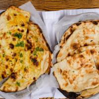 Garlic Naan · Favorite. Vegetarian. Freshly baked white bread topped with fresh garlic and butter.