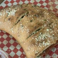 Calzones · Pizza Pocket stuffed with Ricotta cheese, Mozzarella cheese & choice of 2 Toppings (addition...