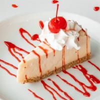 Cheesecake · New York cheesecake topped with either strawberry sauce, caramel sauce, or chocolate sauce.