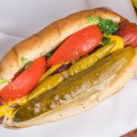 Chicago · Vienna with mustard, neon green relish, onions, tomato wedges, a pickle spear, and a sprinkl...