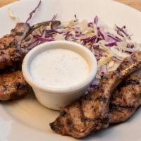 Mini Babas · Four Cajun lamb chops charbroiled with a side of ranch dressing.