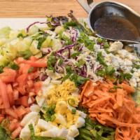 Traditional Cobb Salad · Bacon, bleu cheese, egg, cucumbers, scallions, tomatoes, cabbage, and carrots with your choi...
