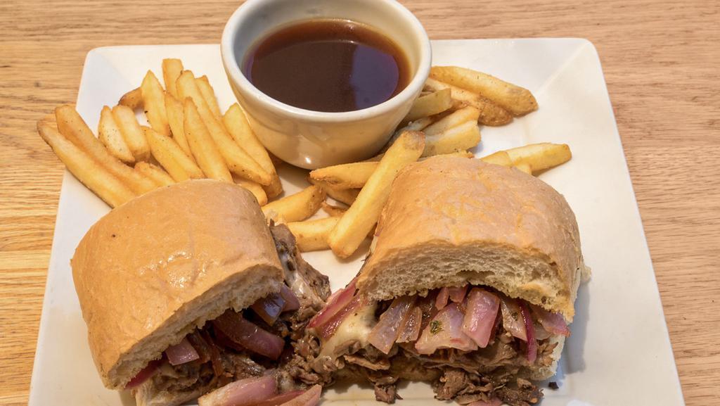 Prime Rib French Dip Sandwich · Our house prime rib thinly sliced and stacked with Swiss cheese and sauteed onions on a French roll. Veggie patties are available.