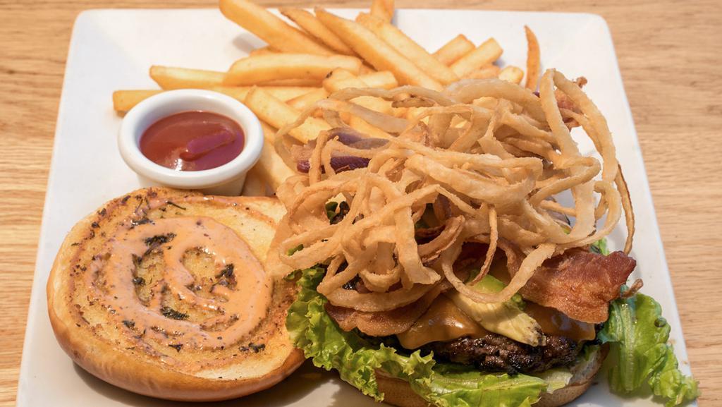 Hungry Hunter Burger · A juicy sirloin burger topped with cheese, bacon, onion strings, avocado, lettuce, tomatoes, and drizzled with our pepper ranch. Veggie patties are available.