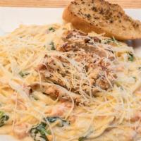 Traditional Fettuccine Alfredo · Fettuccine alfredo with diced tomatoes and spinach. Served with a garlic baguette. We pride ...