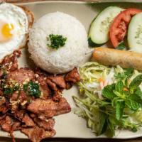 Com Suon Trung Cha Gio · grilled BBQ pork chop with fried eggs and eggroll over steam rice.