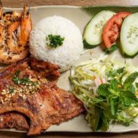 Com Suon Tom Nuong · grilled BBQ pork chop and shrimp over steam rice.