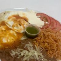 Huevos Rancheros  · eggs over easy or medium , layered on top of a cheese tortilla, topped with salsa and served...