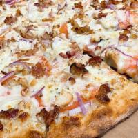 Garlic Chicken Ranch Pizza · Garlic, chicken, bacon, tomatoes, onion and ranch.