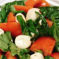 Caprese Salad · Vegetarian. Tomatoes, basil, fresh mozzarella and olive oil.