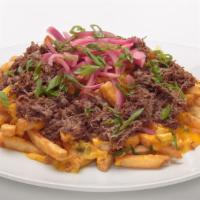 Short Rib Poutine · Our seasoned fries, topped with
homemade jalapeño cheese sauce,
braised short rib, beer grav...