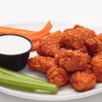 Boneless Wings · All white meat boneless wings tossed in 1 of signature sauces, sprinkled with roasted sesame...