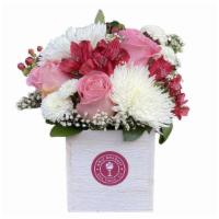 Signature Arrangement In A Vase · Fresh cut flowers artfully arranged in a wooden box vase.