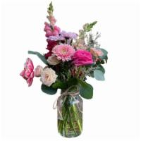 Petite Arrangement In A Vase · Fresh cut flowers artfully arranged in a mason jar.