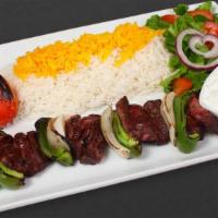 Lamb Shish Kebab Plate · One skewer of grilled lamb. Skewered with grilled onions and grilled bell peppers. Fluffy Ba...
