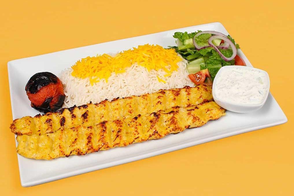 Chicken Koobideh Plate · Two skewers of charbroiled ground chicken seasoned with our special seasonings white rice with saffron, garden salad, pita bread, grilled tomato and an additional side of your choice included in your order.