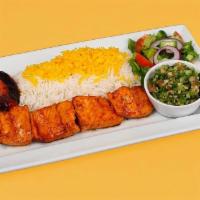 Salmon Kebab Plate · Chunks of charbroiled salmon white rice with saffron, garden salad, pita bread, grilled toma...