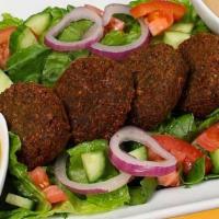 Falafel Plate · 5 pieces of falafel served with the order vegetarian favorite a mixture of garbanzo beans, v...