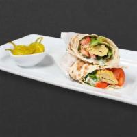 Chicken Koobideh Wrap · Ground chicken breast skewer with tomatoes, lettuce, and sauce. Wrapped in lavash bread. Ser...