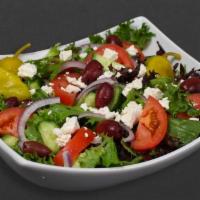 Greek Salad · Mixed greens, tomatoes, cucumber, feta cheese, black olives, and red onion.