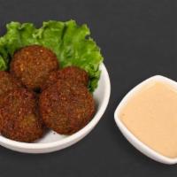 Falafel · Vegetarian favorite a mixture of garbanzo beans, vegetables, and spices 5 pieces.