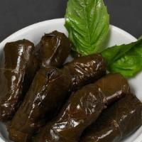 Dolma · Slow-cooked spiced rice, and chopped herbs wrapped in grape leaves 5 pieces.