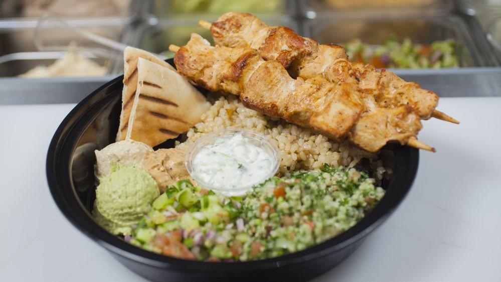 Chicken Plate · Two grilled chicken skewers, rice, hummus, salad, pickles, pita, tzatziki, tahini and hot sauce.