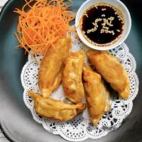 Pot Stickers · Deep fried chicken pot stickers with special house sauce.