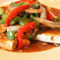 Tofu Steak · Pan fried tofu granite with mushroom, onions, green and red bell pepper in sesame sauce. Veg...