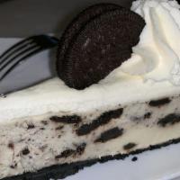 Oreo Cheesecake · Oreo cookie crust, cheesecake filled with Oreo's topped with whipped cream and Oreo cookies.