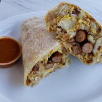 Breakfast Burrito · Served with potatoes, eggs and cheese. And your choice of meat (sausage, bacon or ham).
