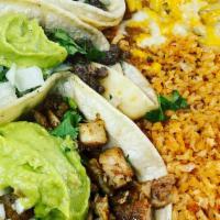 Two Soft Tacos Plate · Two soft tacos with onions and cilantro. Served with Mexican rice, refried beans & guacamole...