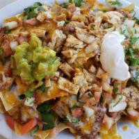Chicken Nachos · Included beans, cheese, pico de gallo, sour cream and guacamole.
