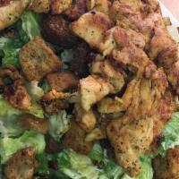 Chicken Caesar Salad · Included romaine lettuce, caesar dressing, croutons, and parmesan cheese. With garlic bread