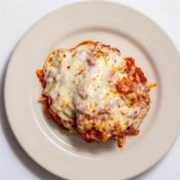 Chicken Parmigiana · Lightly breaded, baked with marinara and mozzarella, served over spaghetti.