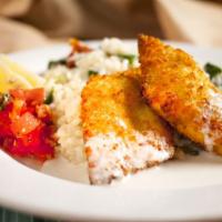 Parmesan Crusted Halibut · With Chardonnay-cream sauce, lemon risotto with peas, spinach and sundried tomato.