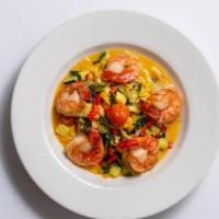 Scampi Al Forno · Sautéed jumbo prawns with linguini and mixed vegetables, in a garlic butter Chardonnay sauce.