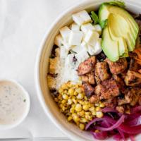 Cali Cobb** · Spring mix with citrus marinated chicken, roasted corn, pickled onion, shaved carrots, avoca...