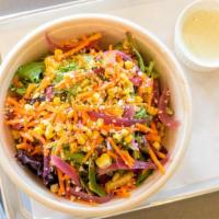 Pure Greens** · Mixed greens with roasted corn, pickled onion, shredded carrots, cotija cheese, and tortilla...