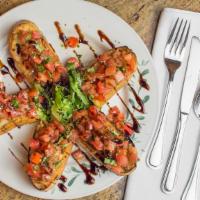 Bruschetta · Toasted bread with garlic. fresh ripe tomatoes, basil, and garlic olive oil.