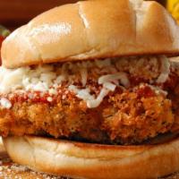 Chicken Parm Sandwich · Juicy breast of chicken lightly breaded with marinara sauce and mozzarella, served on Italia...