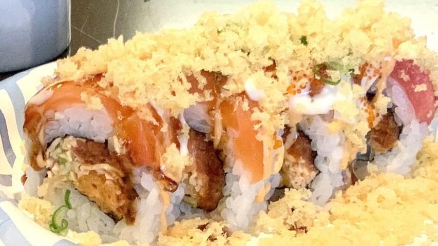 Hollywood · Spicy. Spicy tuna, spicy crab avocado, shrimp tempura top with hamachi, albacore, tuna, sauce tempura flakes tobiko & onion